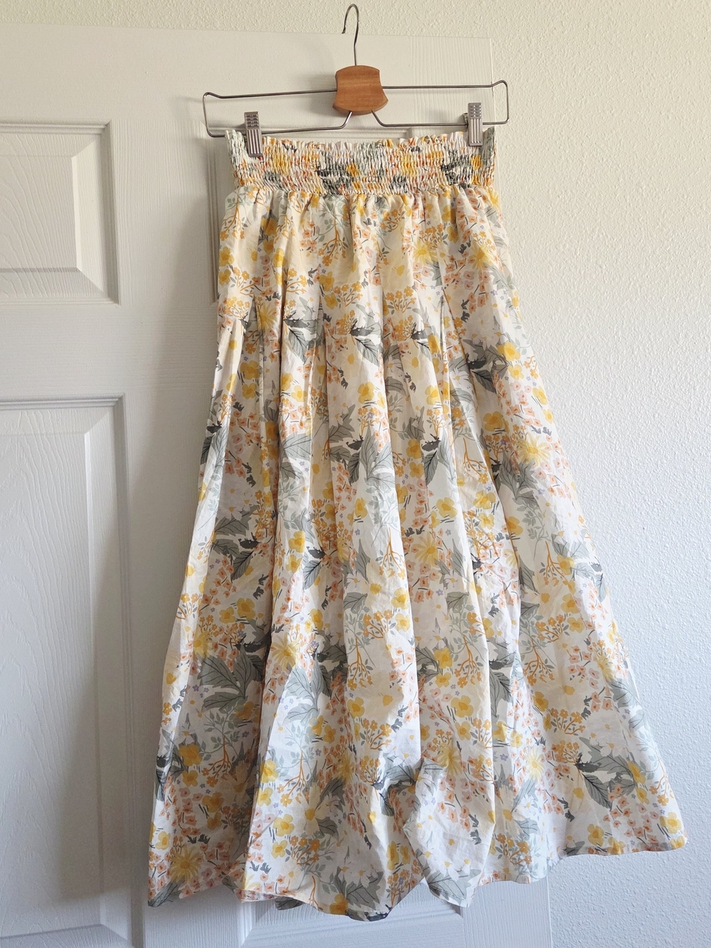 Buru cotton smocked waist skirt featuring a yellow and white floral prin